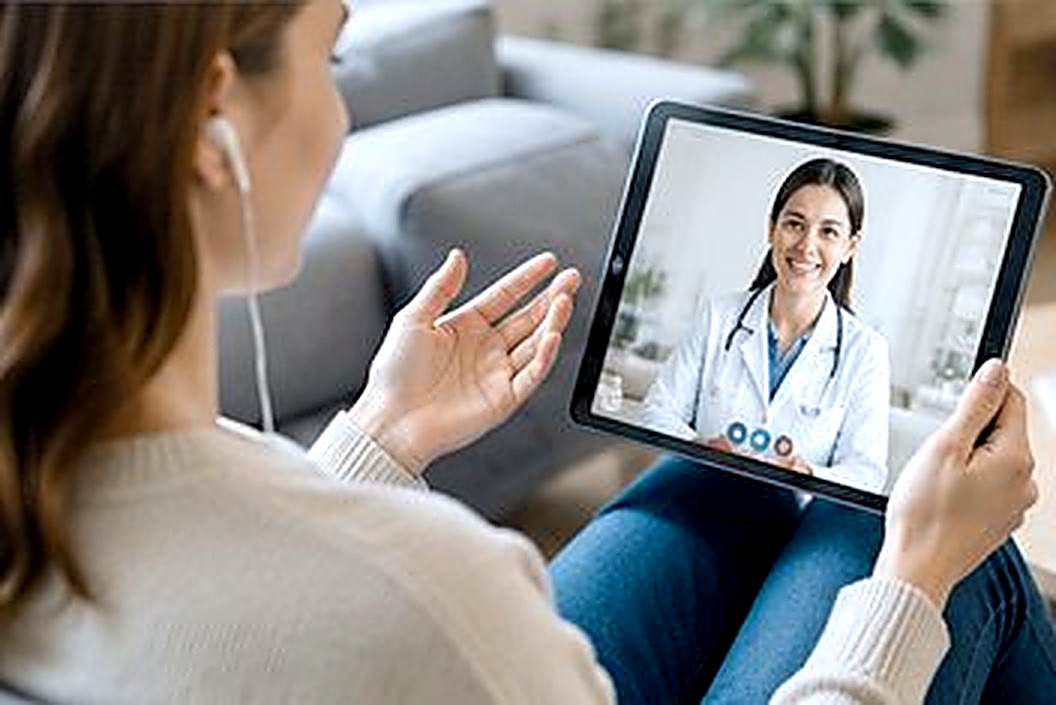Patient alone with an online consultation on a tablet
