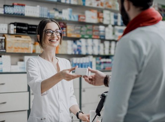 Pharmacist talking a patient through results