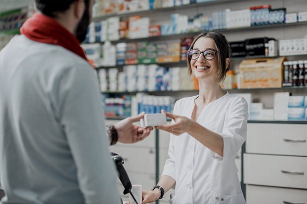 Pharmacist handing over a prescription